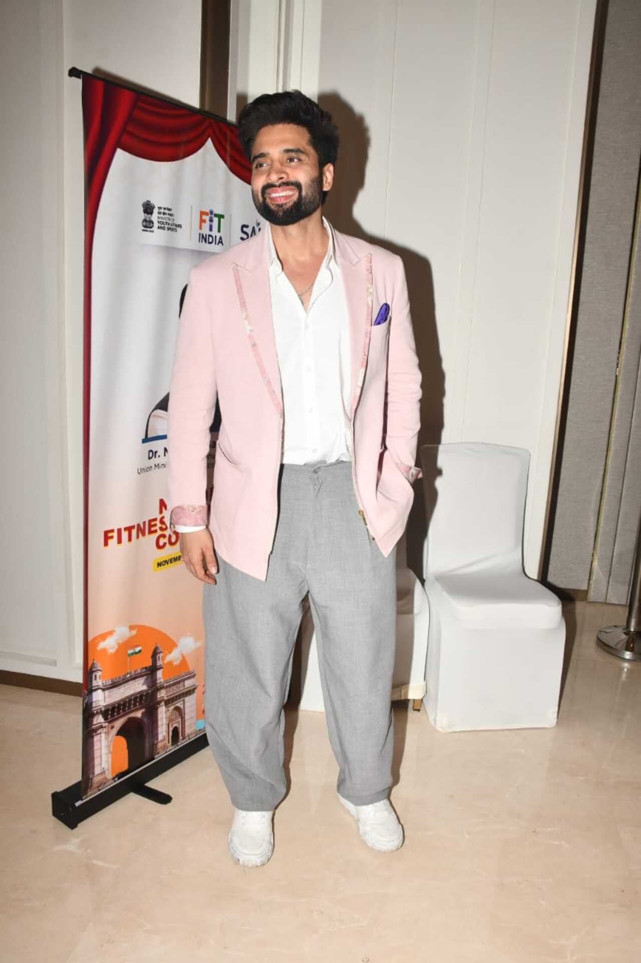 Jackky Bhagnani looked dapper in a blush pink blazer layered over a crisp white shirt. He paired it with relaxed grey trousers.
